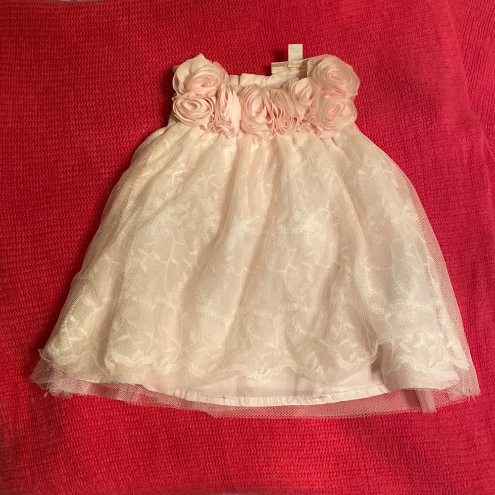 2 baby girl dresses. One baby pink one white. Both are floral and lined.